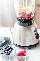 Image showing close up of blender with berries and fruits