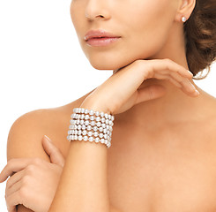 Image showing woman with pearl earrings and bracelet