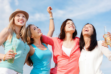 Image showing girls with drinks on the beach