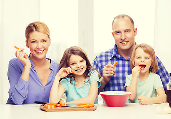 Image showing happy family with two kids eating at home