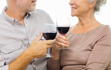 Image showing close up of happy senior couple with red wine