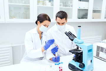 Image showing young scientists making test or research in lab