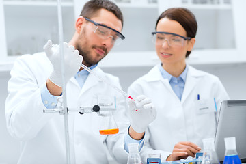 Image showing young scientists making test or research in lab