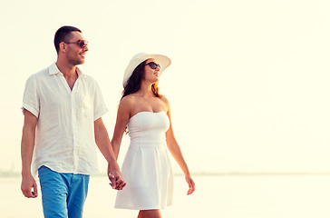 Image showing smiling couple walking outdoors