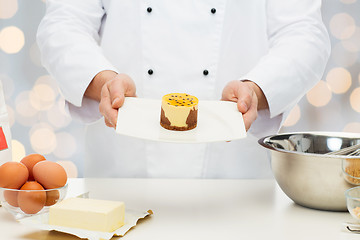 Image showing close up of male chef cook baking dessert