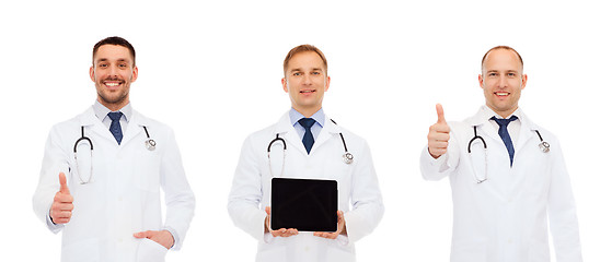 Image showing happy doctors with tablet pc showing thumbs up