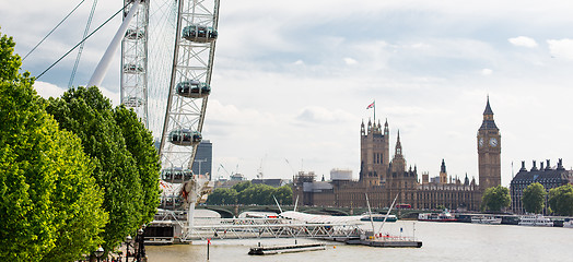 Image showing Houses of Parliament and ferris wheel in London