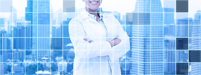 Image showing happy african american female doctor over city