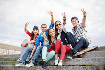 Image showing group of smiling teenagers hanging out