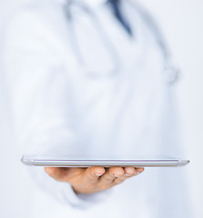 Image showing male doctor holding tablet pc