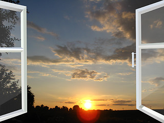 Image showing window opened to the sunset