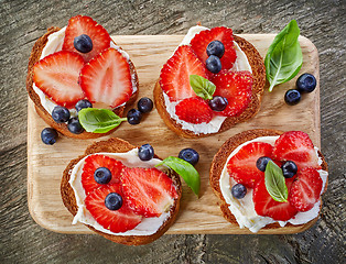 Image showing toasted bread with berries and cream cheese