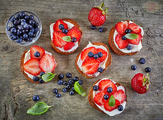 Image showing toasted bread with berries and cream cheese