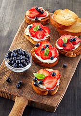 Image showing toasted bread with berries and cream cheese