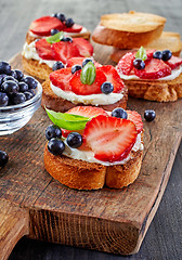 Image showing toasted bread with berries and cream cheese