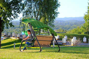 Image showing Woman on swing