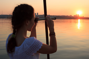 Image showing Girl watching spyglass