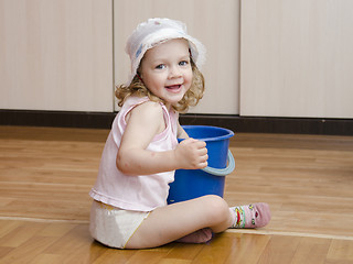 Image showing Little girl wash rag floors