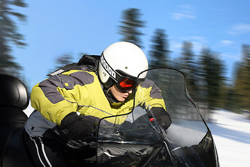 Image showing Teen boy on snowmobile