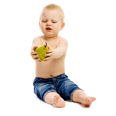 Image showing dissatisfied boy disclaims pears on a white background