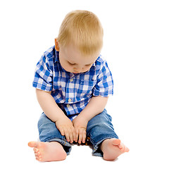 Image showing little boy in a plaid shirt and jeans