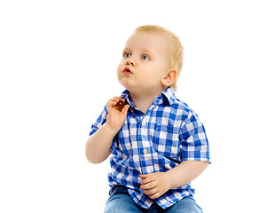 Image showing little boy in a plaid shirt and jeans