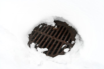 Image showing Manhole cover in white snow