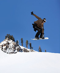 Image showing Snowboarder jumping