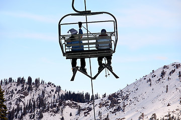 Image showing Skiers on chairlift