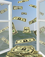 Image showing opened window to the sea with dollars