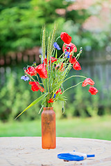 Image showing Bunch of of red poppies and cornflowers