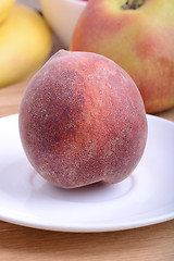 Image showing peach,  apple and strawberry on wooden plate 