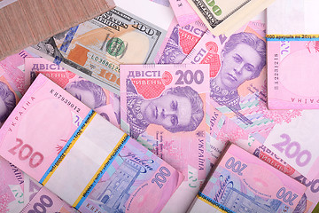 Image showing american money dollars, ukrainian money hryvnia, financial backg