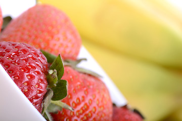 Image showing healthy strawberry smoothie with fruits on wooden background