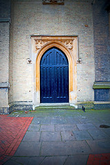 Image showing brown wooden parliament in london old  door and marble antique  