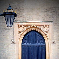 Image showing brown wooden parliament in london old  door and marble antique  