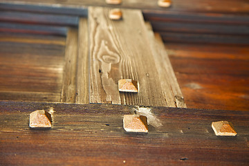 Image showing red abstract  house door    in italy       closed nail rusty