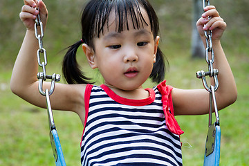 Image showing Asian Kid Swing At Park