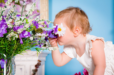 Image showing Little girl and flower