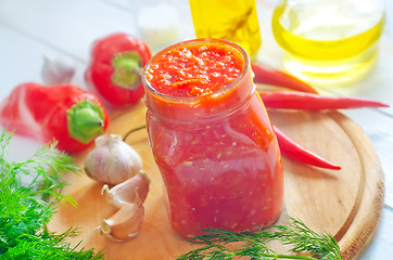 Image showing Fresh chilli sauce in the glass bank