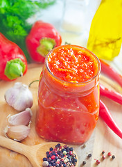 Image showing Fresh chilli sauce in the glass bank