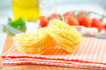 Image showing raw pasta and tomato