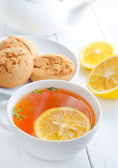 Image showing Fresh tea with lemon in the white cup