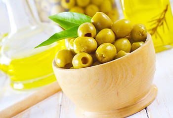 Image showing green olives and oil