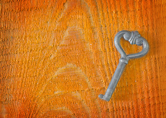 Image showing key on wooden background