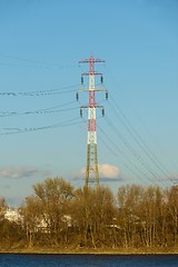 Image showing Large electric pylon with blue sky