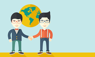 Image showing Two chinese guys happily handshaking.