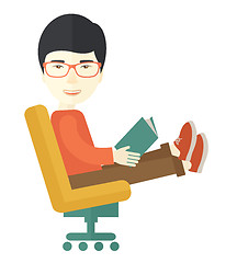 Image showing Asian Man sitting with a book