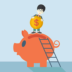 Image showing Big piggy bank with ladder