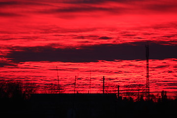 Image showing Dark sunset above the multistory house